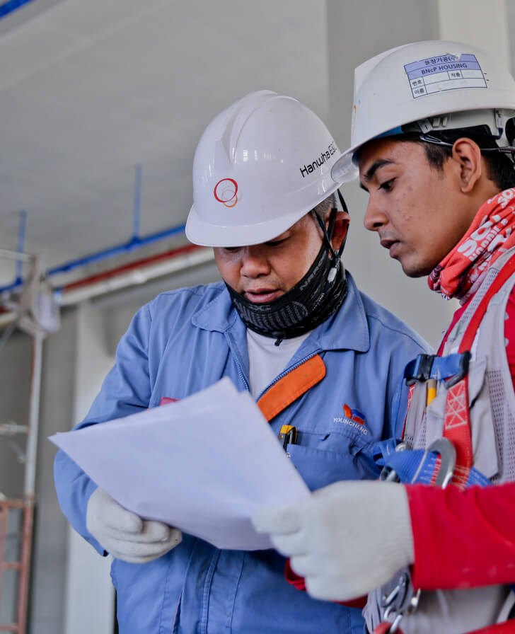 Roofing contractors reviewing a roofing project in Pasadena California