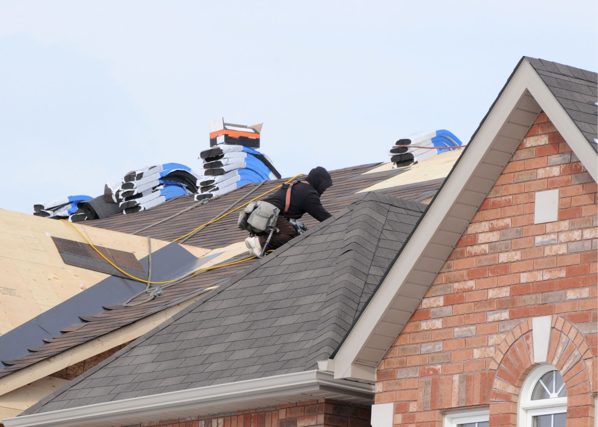 Residential shingle roofing work in progress on a Pasadena home